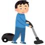 掃除機をかける男性