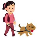 A woman taking a dog walk
