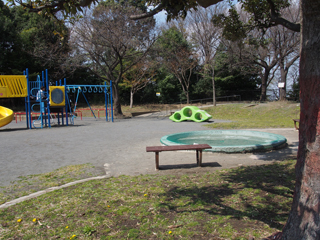 Playground equipment and benches at Higashihongodai Park