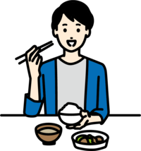 朝食を食べる男性の